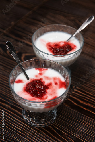 Raspberry yougurt on wooden