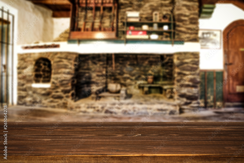 Desk of free space and fireplace in home interior. Wild west background. 