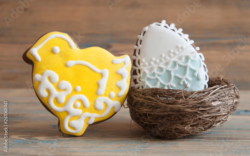 Colorful easter cookies on a wooden background