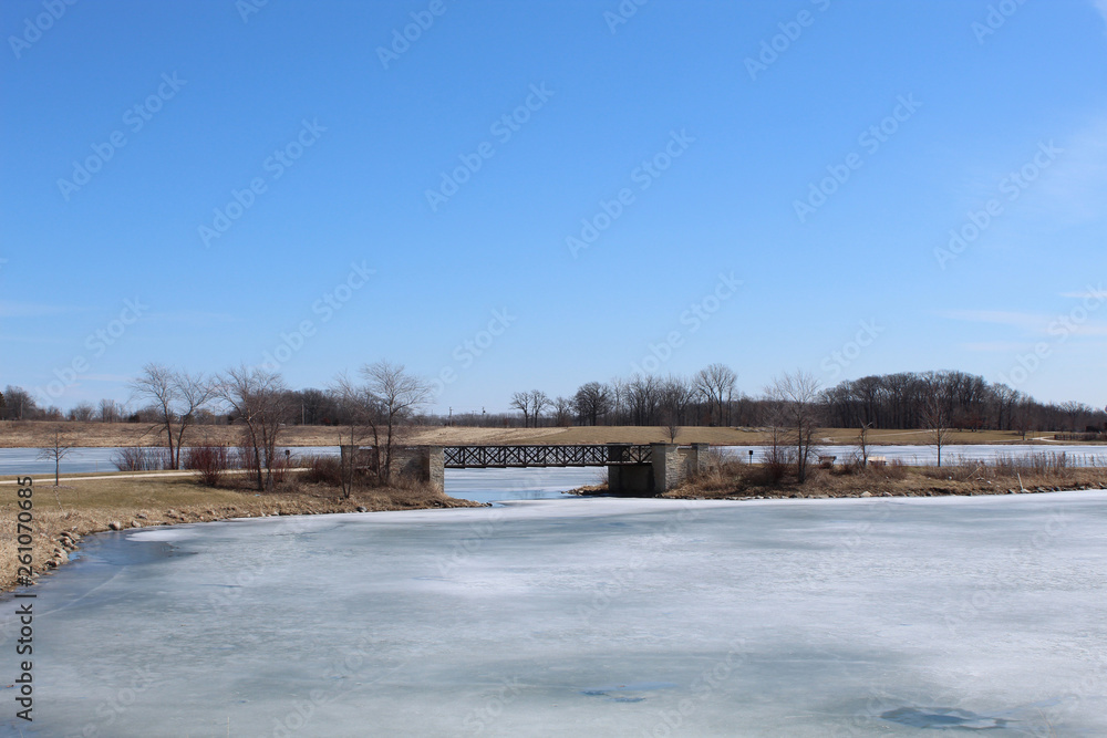 Foot bridge over a frozen lake at Independence Grove in Libertyville, Illinois