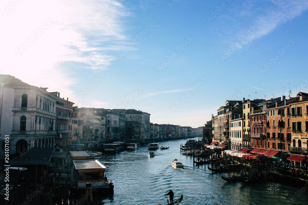 Grand Canal in Venice on a sunny day, Italy. Venice in the sunlight. Scenic panoramic view of Venice in winter. Cityscape and landscape of Venice. Romantic water trip.