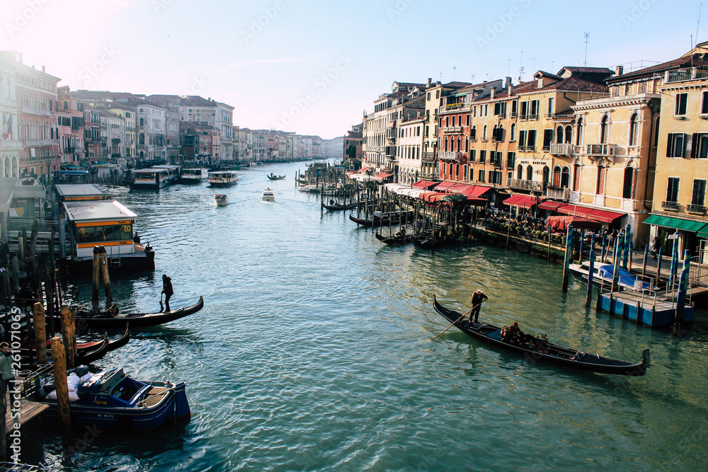 Grand Canal in Venice on a sunny day, Italy. Venice in the sunlight. Scenic panoramic view of Venice in winter. Cityscape and landscape of Venice. Romantic water trip.