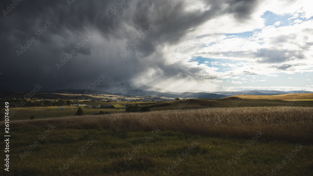 Fototapeta premium storm moving over a prairie town 