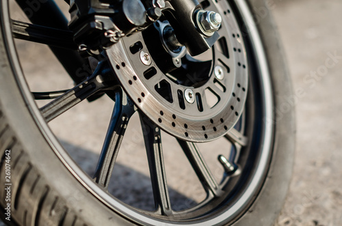 motorcycle wheel with brake disc closeup © Sofiia