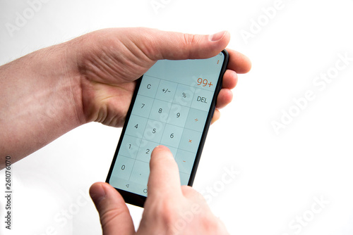 Wallpaper Mural make calculations on a smartphone. Torontodigital.ca