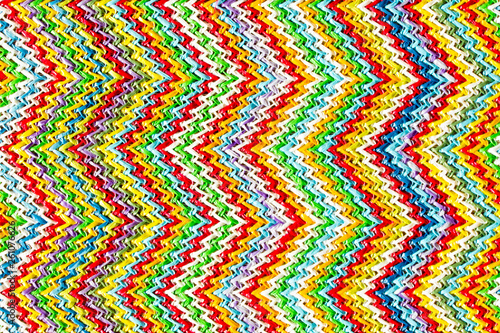 Abstract textured zigzag background of close up detail in woven raffia