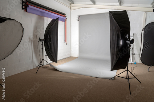 Salisbury, Wiltshire, UK. April 2019. Lights and coloured backdrops in a photographic studio.