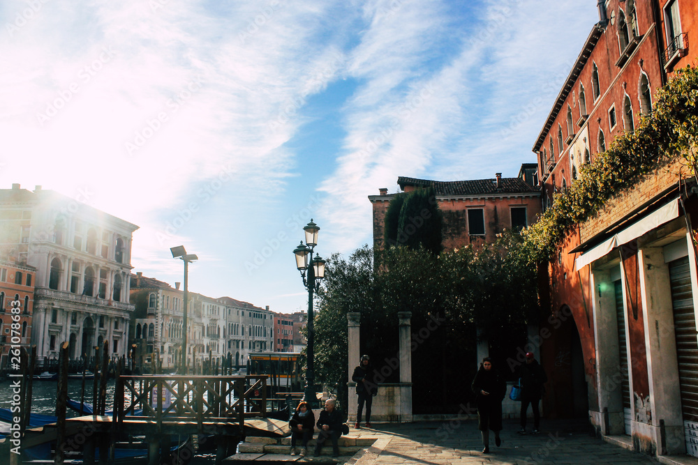 Naklejka premium Grand Canal in Venice on a sunny day, Italy. Venice in the sunlight. Scenic panoramic view of Venice in winter. Cityscape and landscape of Venice. Romantic water trip.