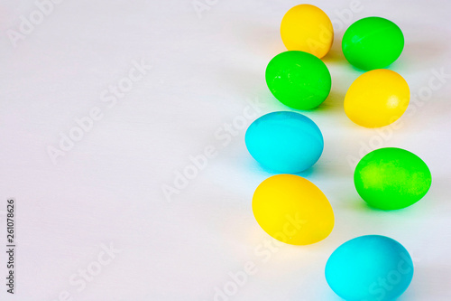 Easter eggs multicolored isolated on white background. Minimal easter concept. Happy easter card with copy space for text. Top view  flat.