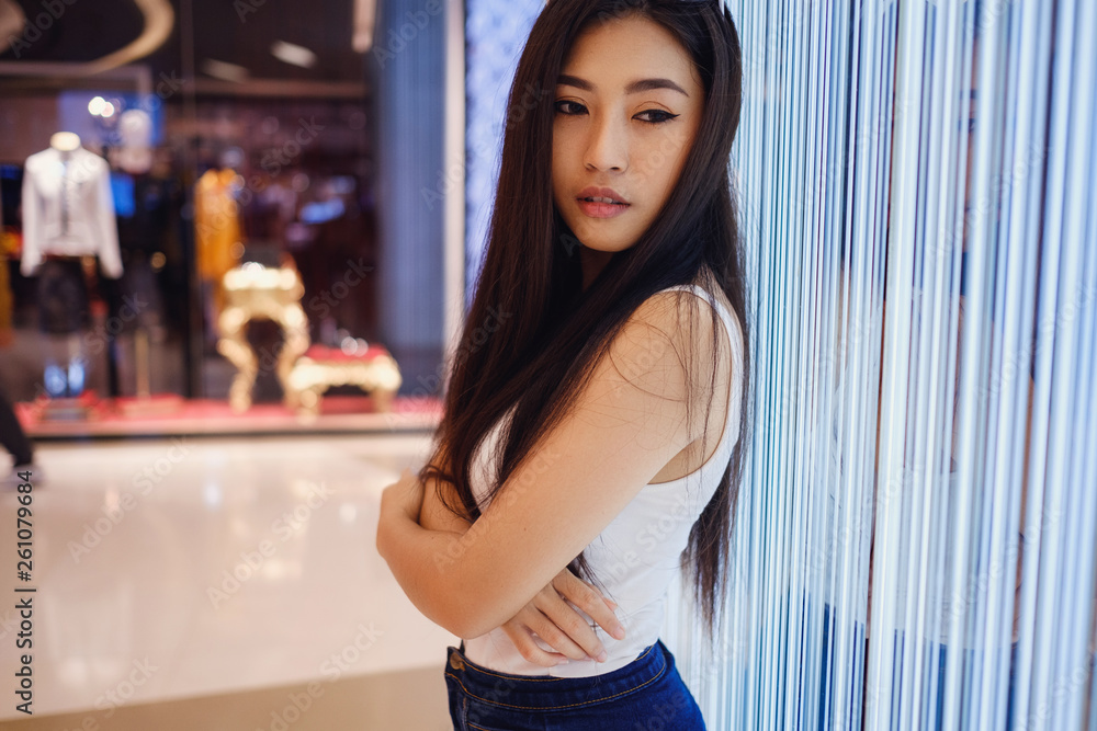 Young beautiful asian girl in big mall, bangkok