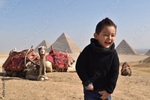 Kid smiling Egypt pyramid traveling with kids
