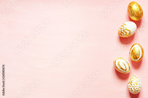 Top view of easter eggs colored with golden paint in differen patterns. Copy space. - Image