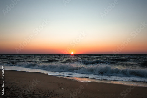 Sea       beach at sunrise. Sea       waves on a sandy beach. Tropical vacation background. Natural landscape. Sunset ocean horizon sky landscape. Blue ocean waves. Colorful ocean beach sunrise.