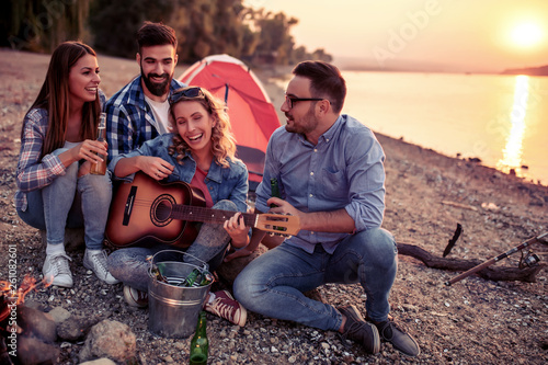 Group of friends have fun on camping