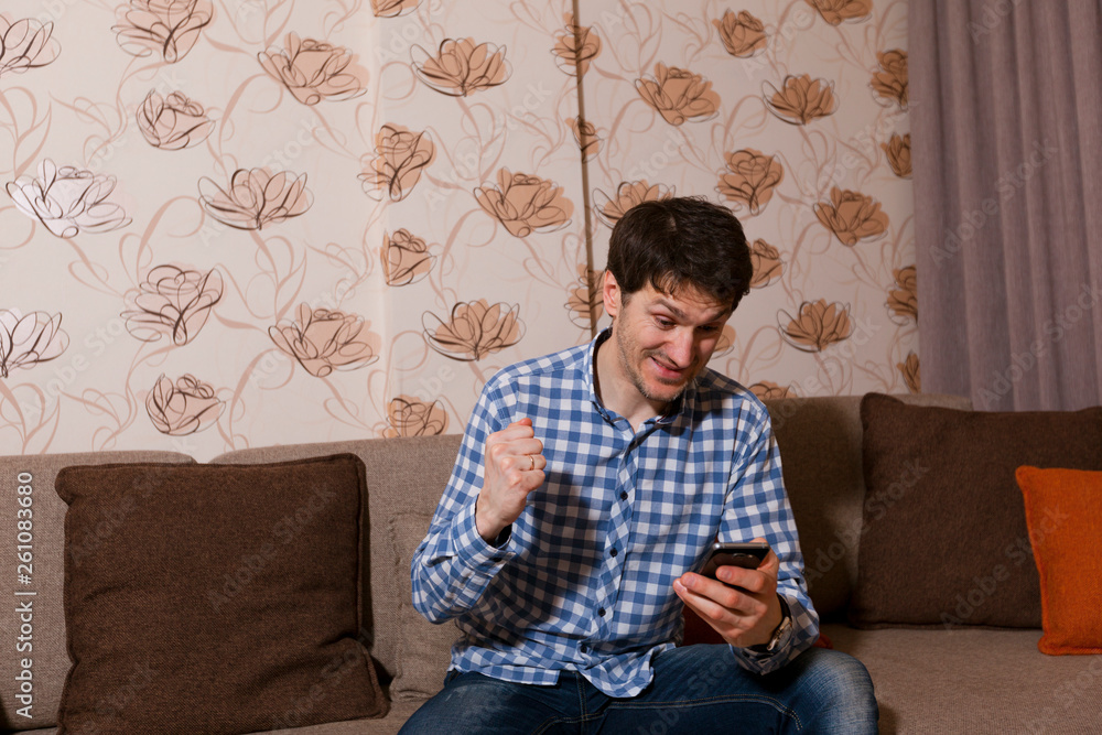Joyful guy with a phone in his hand Joyful guy with a phone in his hand