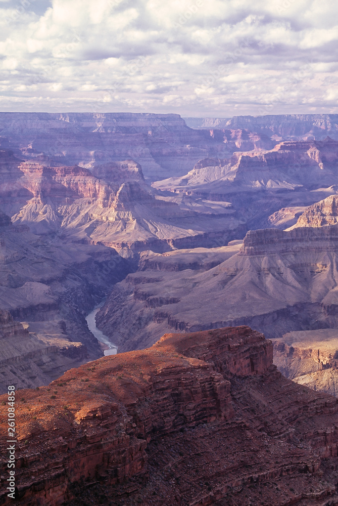 Afternoon light paints the west rim of the Grand Canyon. Photographed from Hopi Point, Grand Canyon National Park, Arizona. Image captured on Fuji Velvia film with Nikon F4 camera. Afternoon light paints the west rim of the Grand Canyon. Photographed from Hopi Point, Grand Canyon National Park, Arizona. Image captured on Fuji Velvia film with Nikon F4 camera.
