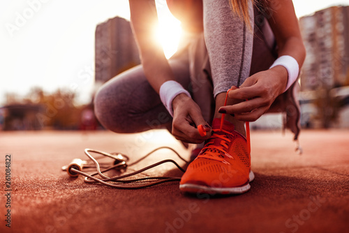 Fototapeta Naklejka Na Ścianę i Meble -  Woman preparing for jogging