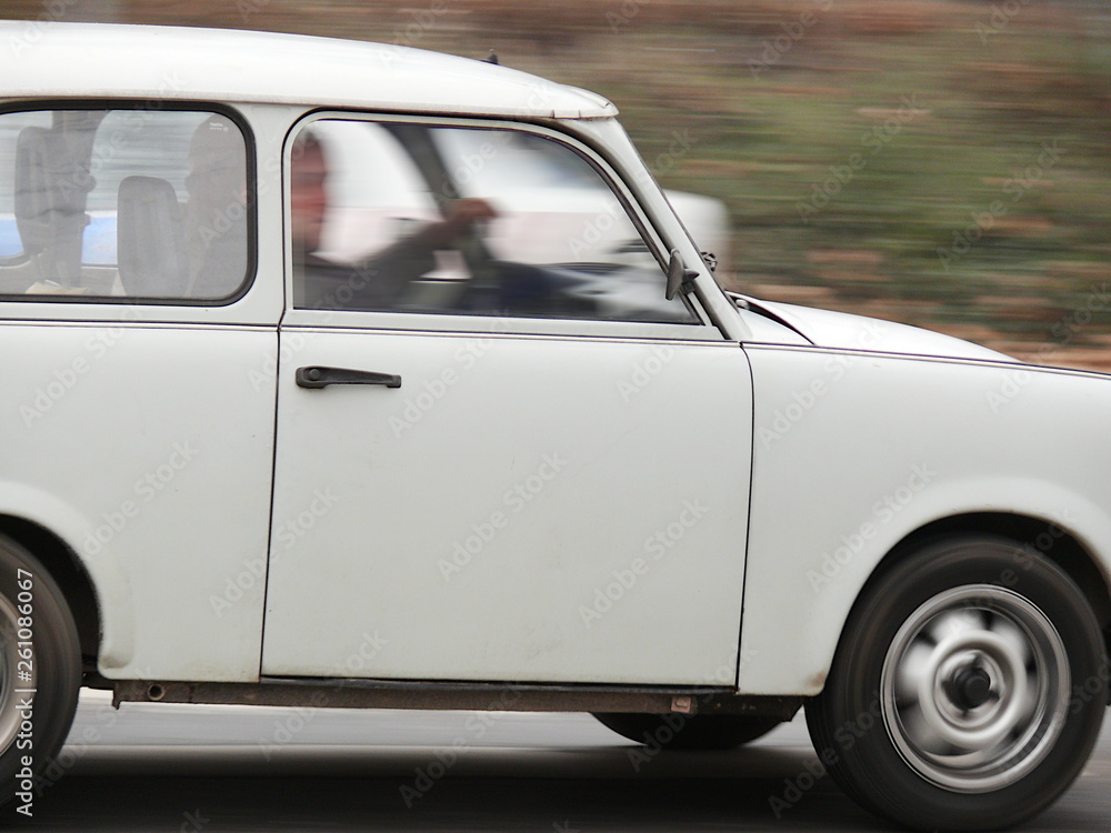 Ancient Trabant car. A Trabant runs through the streets of Budapest Ancient Trabant car. A Trabant runs through the streets of Budapest