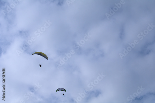 paraglider in the sky,fly, sport,sky, parachute,cloud, flight, high, paraglide, wind, sports, fun,, freedom, adventure, glider, 