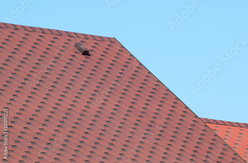 Decorative metal tile on a roof
