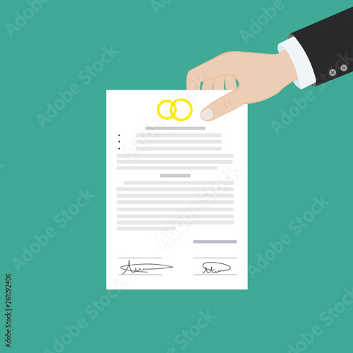 Prenuptial agreement in man and woman hands. Family and law concept