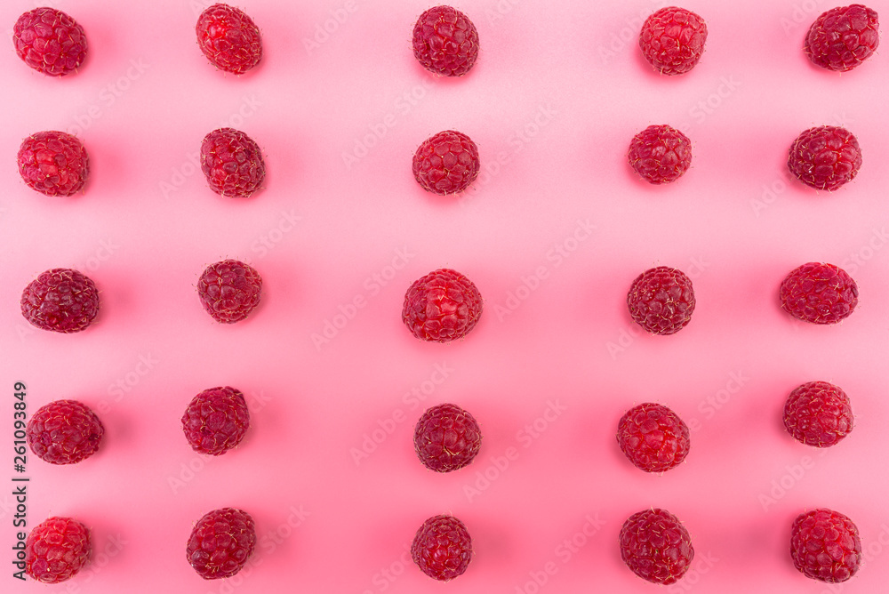 Pattern made from fresh raspberries, top view, flat lay pattern, isolated on a light pink background. Pattern made from fresh raspberries, top view, flat lay pattern, isolated on a light pink background.