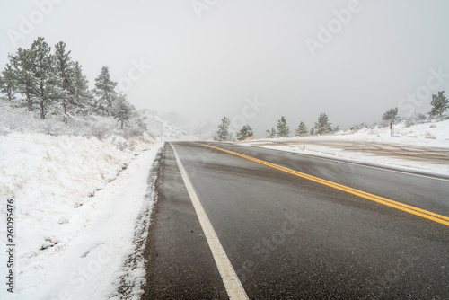 mountain highway in a heavy April snowstorm