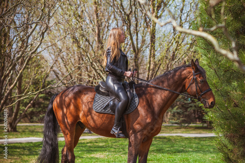 Woman on a horse at rancho. Horse riding, hobby time. Concept of animals and human  © T.Den_Team