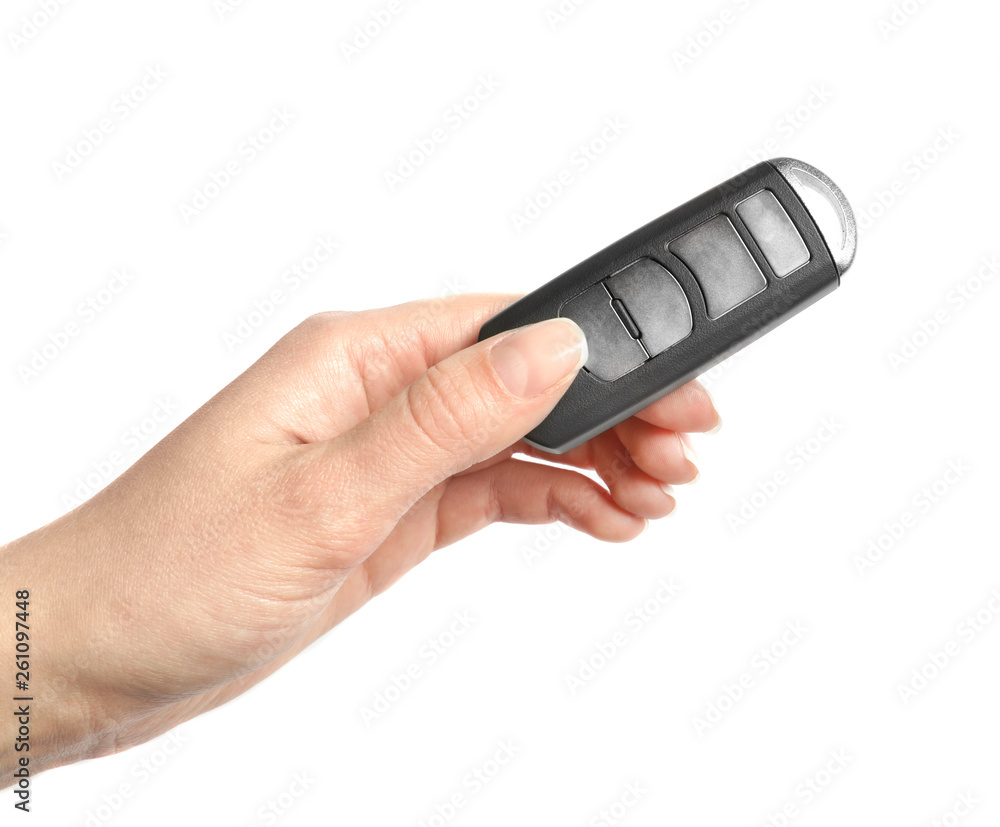 Woman holding car smart key isolated on white Woman holding car smart key isolated on white