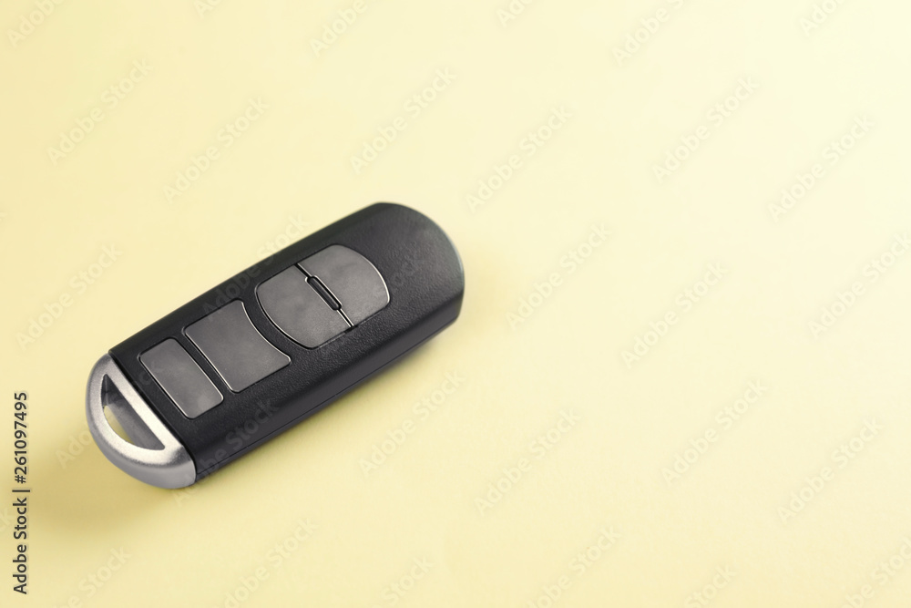 Fototapeta premium Car smart key on color background. Space for text