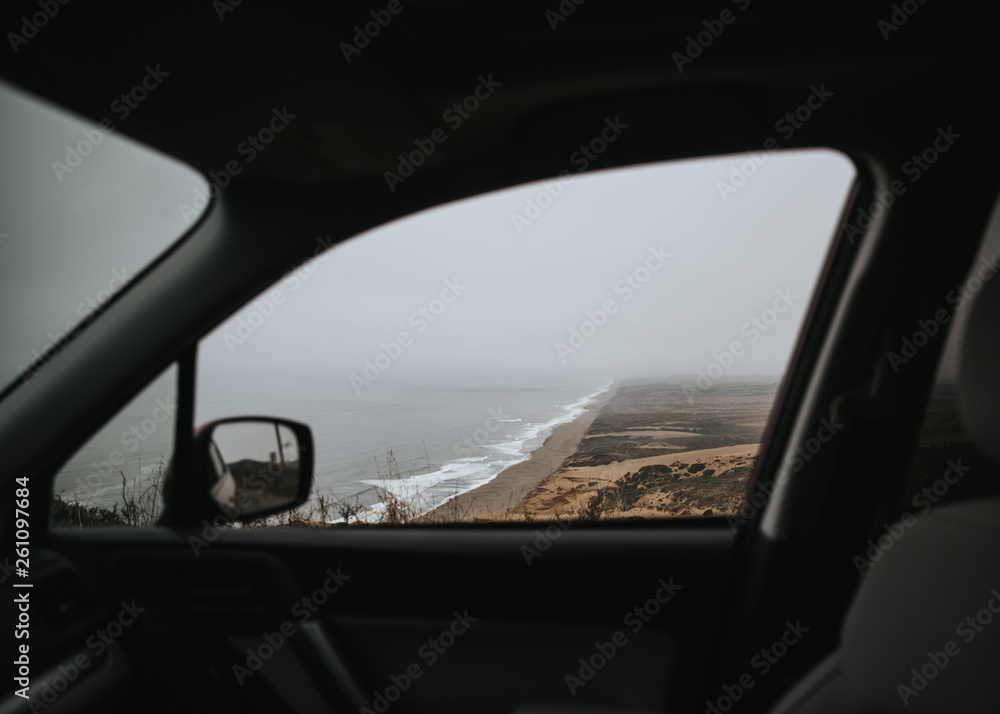 View of ocean through car window View of ocean through car window
