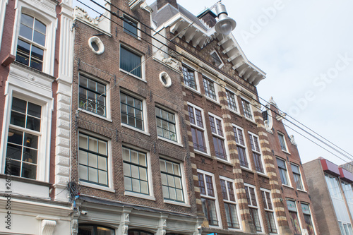 Photography Typical old houses of Amsterdam, Netherlands under blue sky in spring