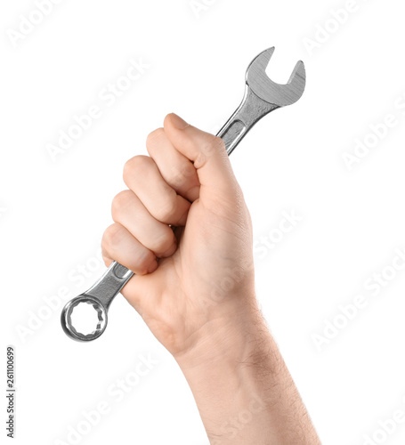 Man holding combination wrench isolated on white, closeup. Plumbing tools