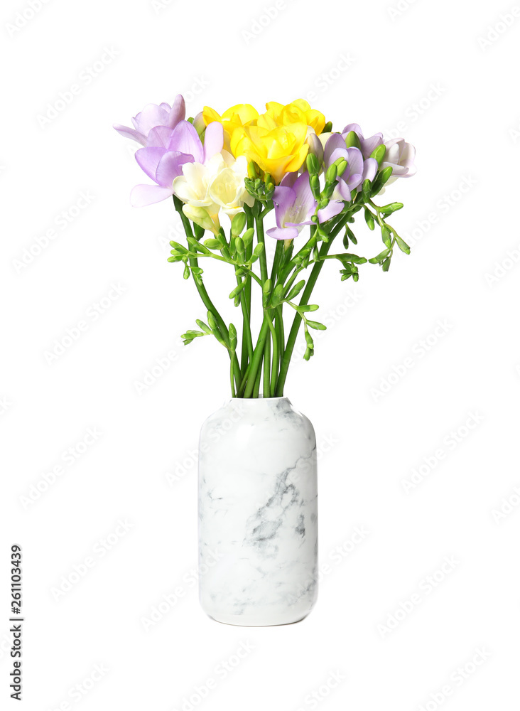 Bouquet of fresh freesia flowers in vase isolated on white Bouquet of fresh freesia flowers in vase isolated on white