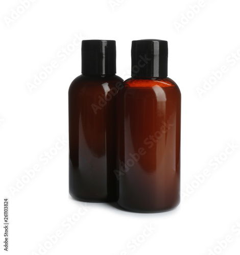 Mini bottles with cosmetic products on white background. Hotel amenities