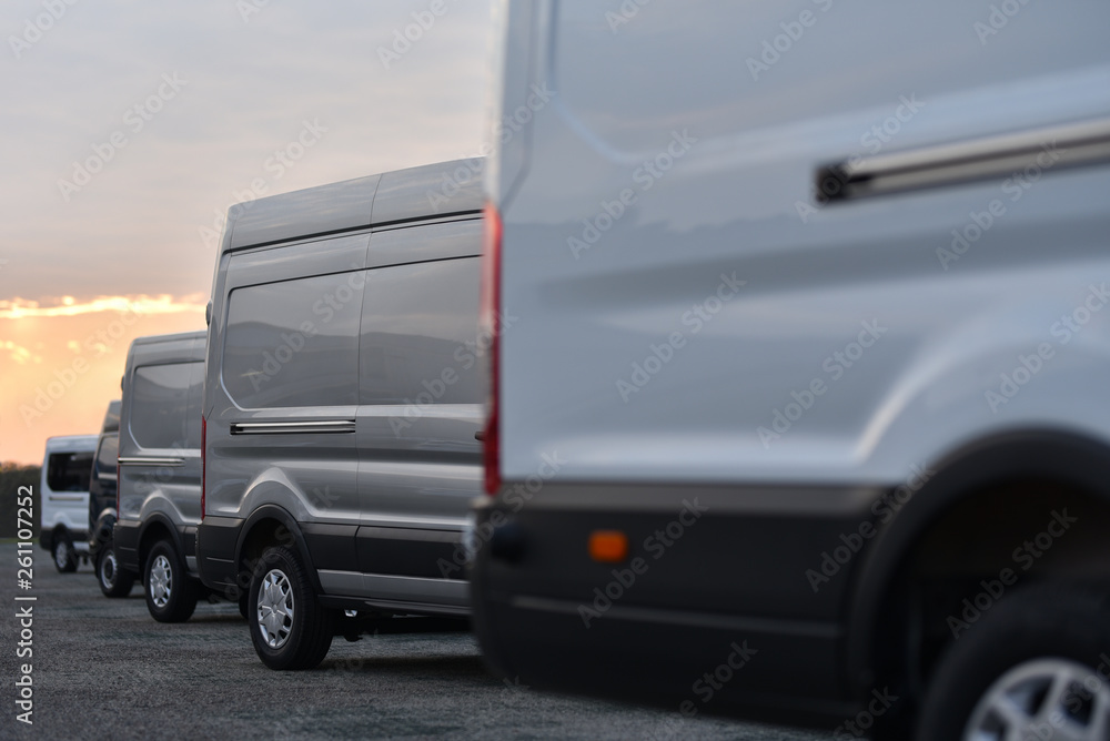 vans of delivery service parked in row vans of delivery service parked in row