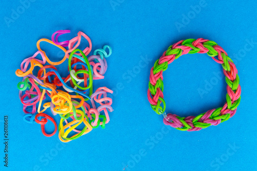 Chaos and order. Rubber bands for weaving loose and bracelet of rubber bands