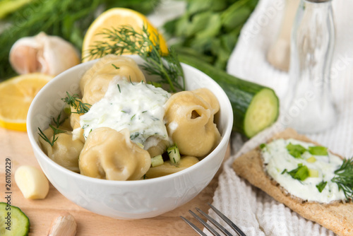 dumplings with sour cream and greens