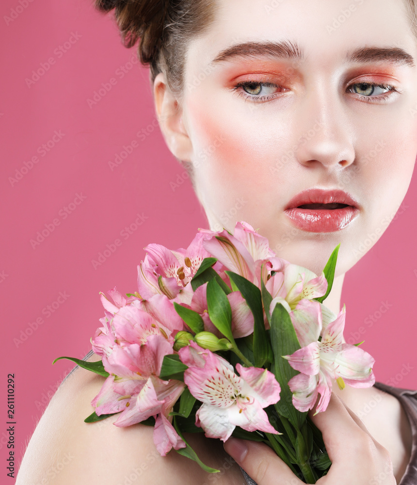 model with perfect make up and pink flowers