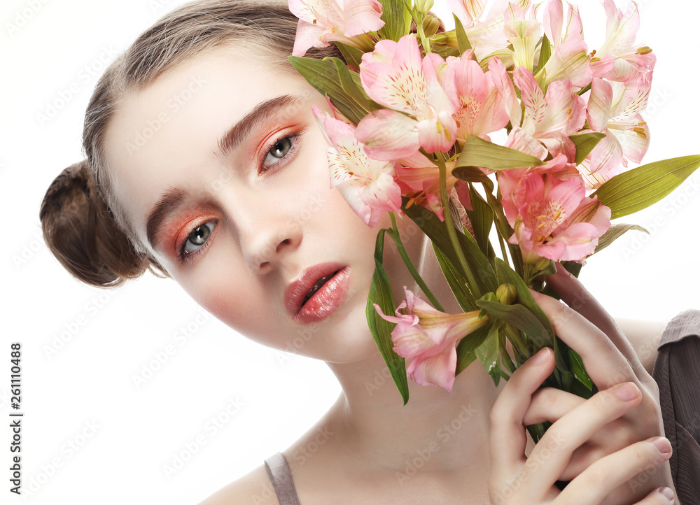 model with perfect make up and pink flowers model with perfect make up and pink flowers