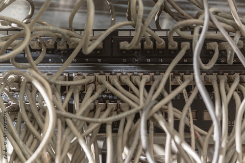 Messy network cabling at switch router cabinet.