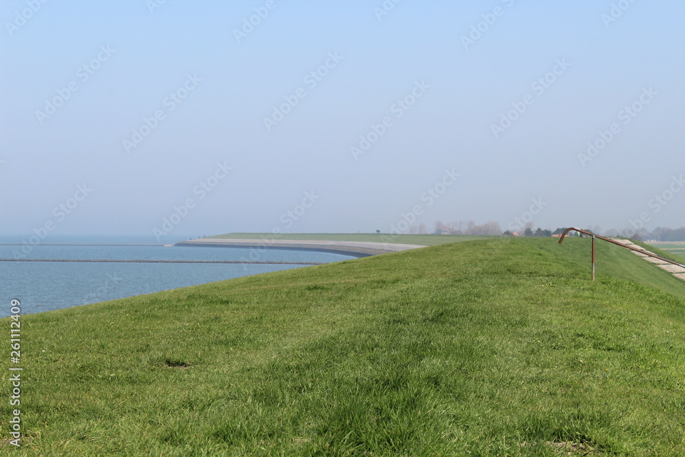 Ostbense, Germany: the dike along the coast on the Wadden Sea Ostbense, Germany: the dike along the coast on the Wadden Sea