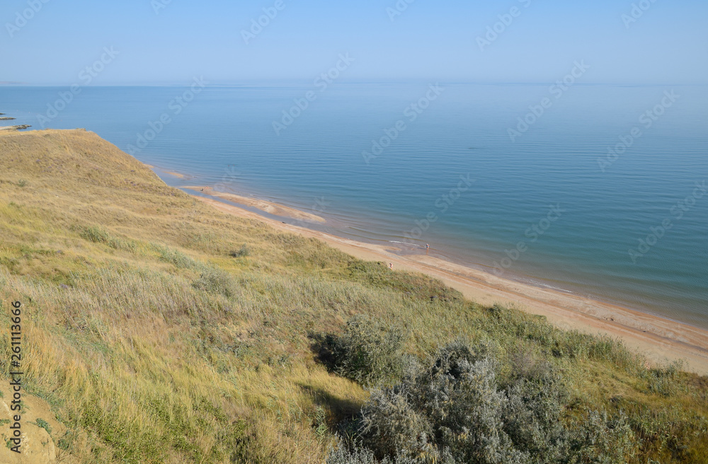 The hilly coast near the Sea of Azov. Clay rocks, a cliff on the shore