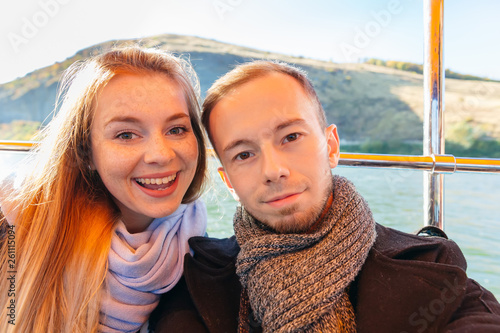 selfie couple on a boat. boat trip. look at the camera and smile