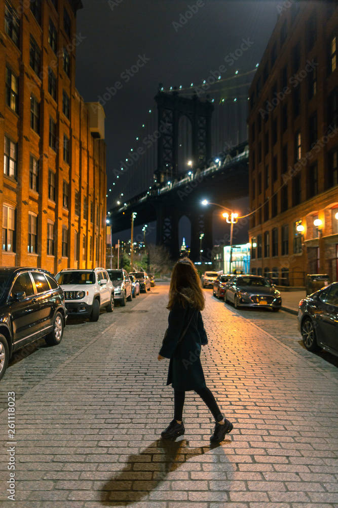 Women walking on the streets of Dumbo at night