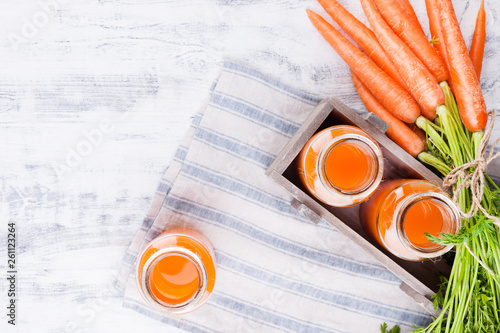 fresh carrot juice in a jar. Fresh carrots with leaves and drink. Spring food for health and beauty.