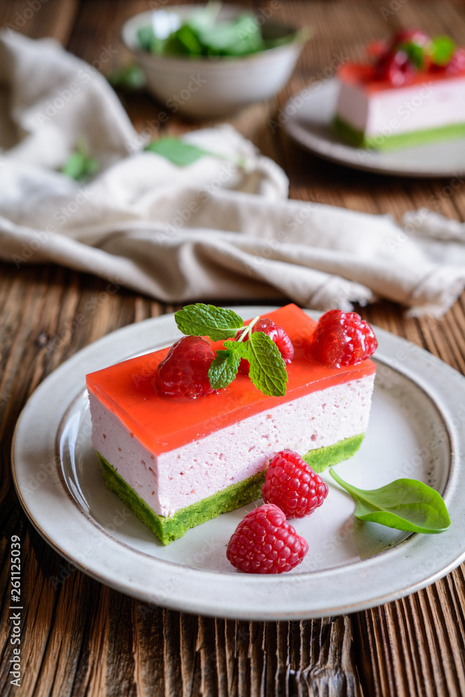 Sweet spinach cake with raspberry mousse and layer of jelly