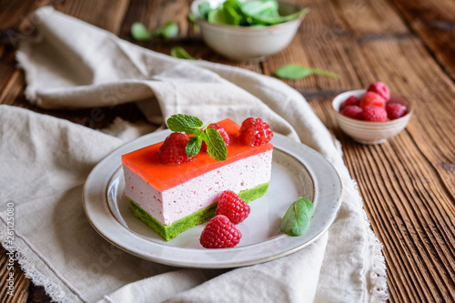 Sweet spinach cake with raspberry mousse and layer of jelly