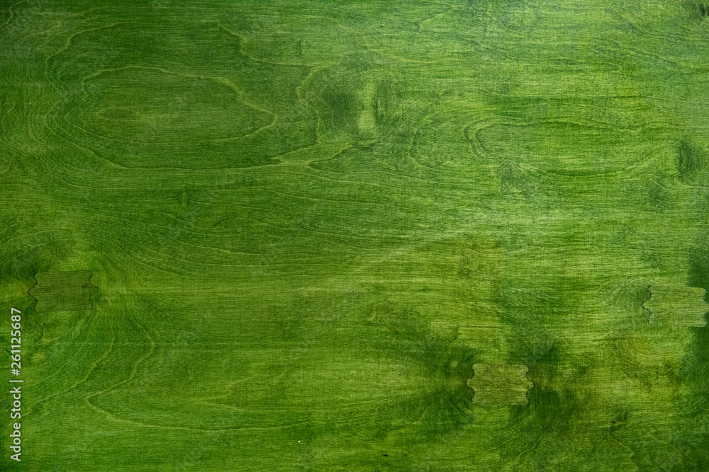 Naklejka premium Tło - blat drewniany, drewno pomalowane na zielono 