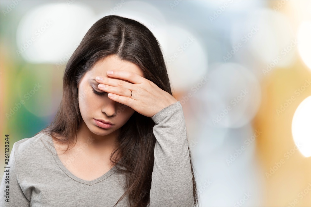 Young sad woman on background Young sad woman on background